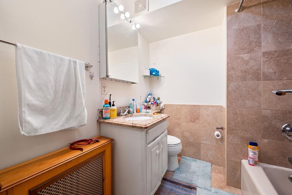 38 Corbin Place Brooklyn, NY 11235 - Photo 10 of 31 a utility room with sink dryer and washer