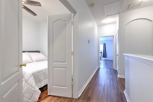 a view of hallway with wooden floor
