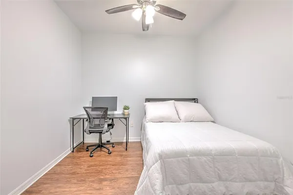 a bedroom with a bed and a table