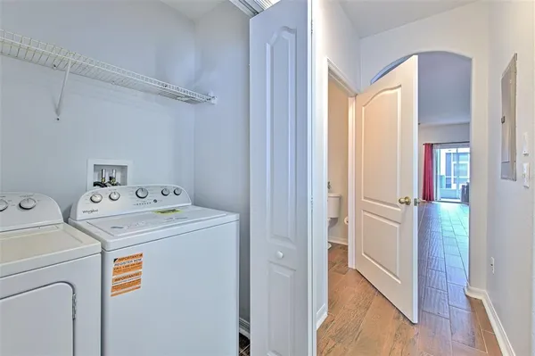 a view of storage and utility room with washer and dryer