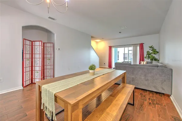 a room with pool table and windows