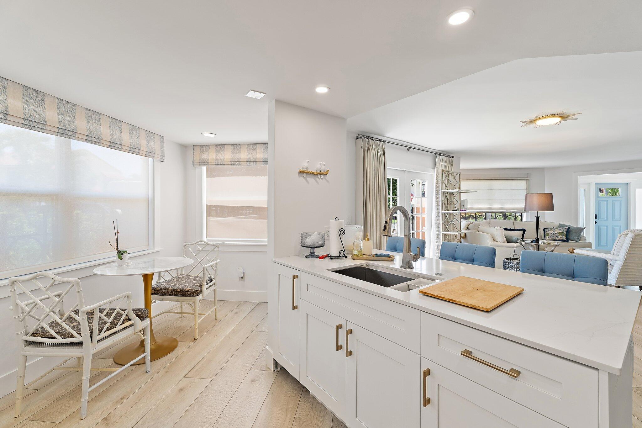 15 Uno Lago Drive, Unit 15 Juno Beach, FL 33408 - Photo 17 of 50 a view of living room with furniture and window