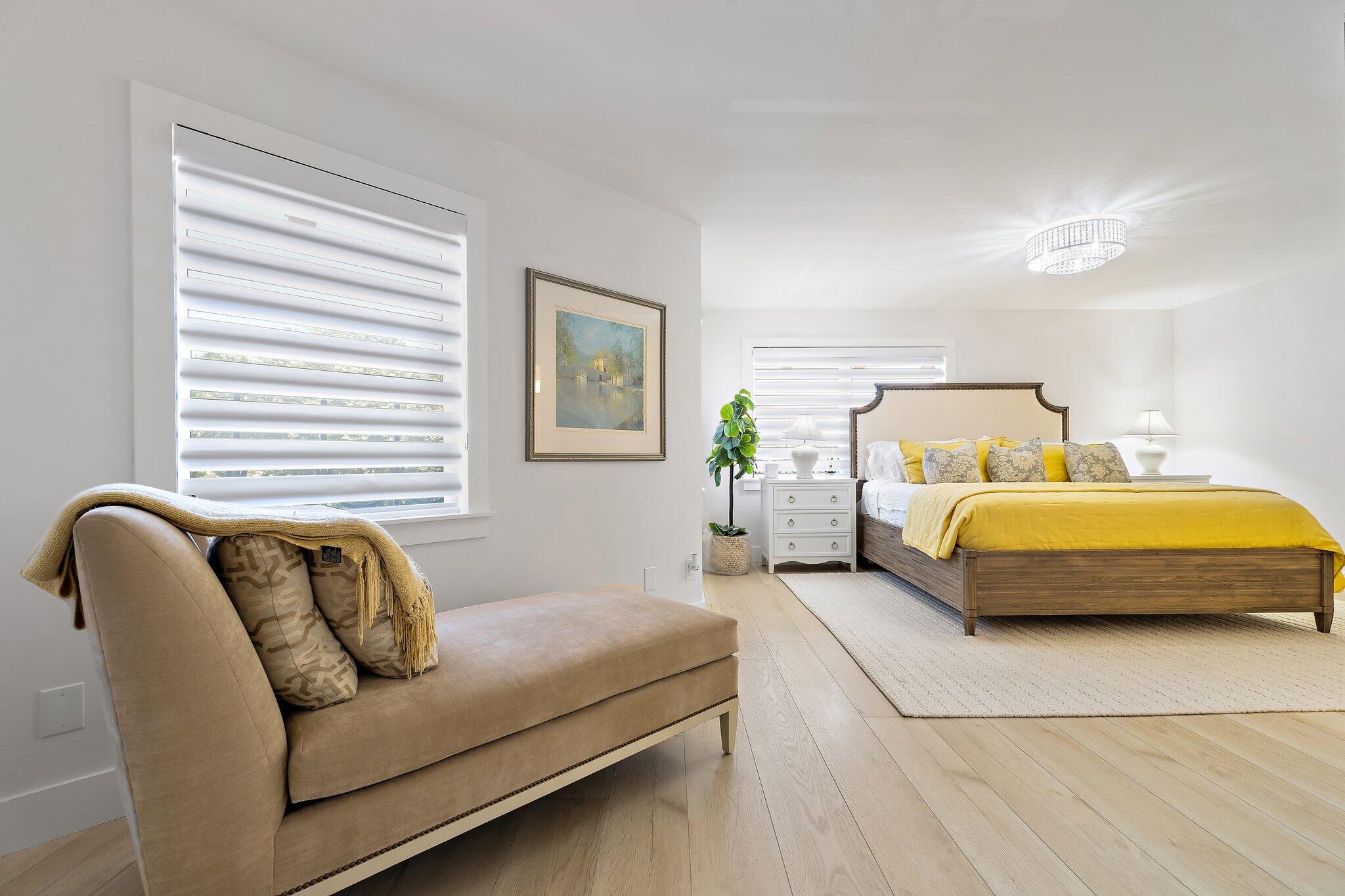 15 Uno Lago Drive, Unit 15 Juno Beach, FL 33408 - Photo 24 of 50 a bedroom with a bed couch and window