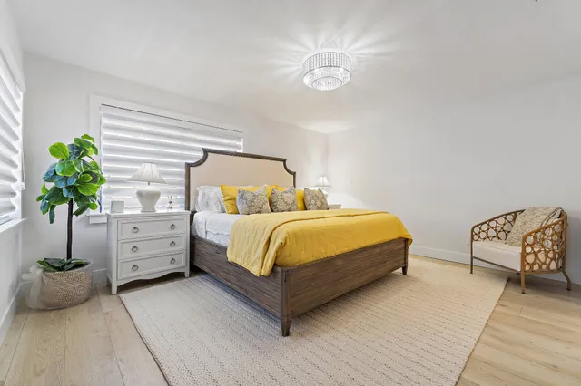 a bedroom with bed and window