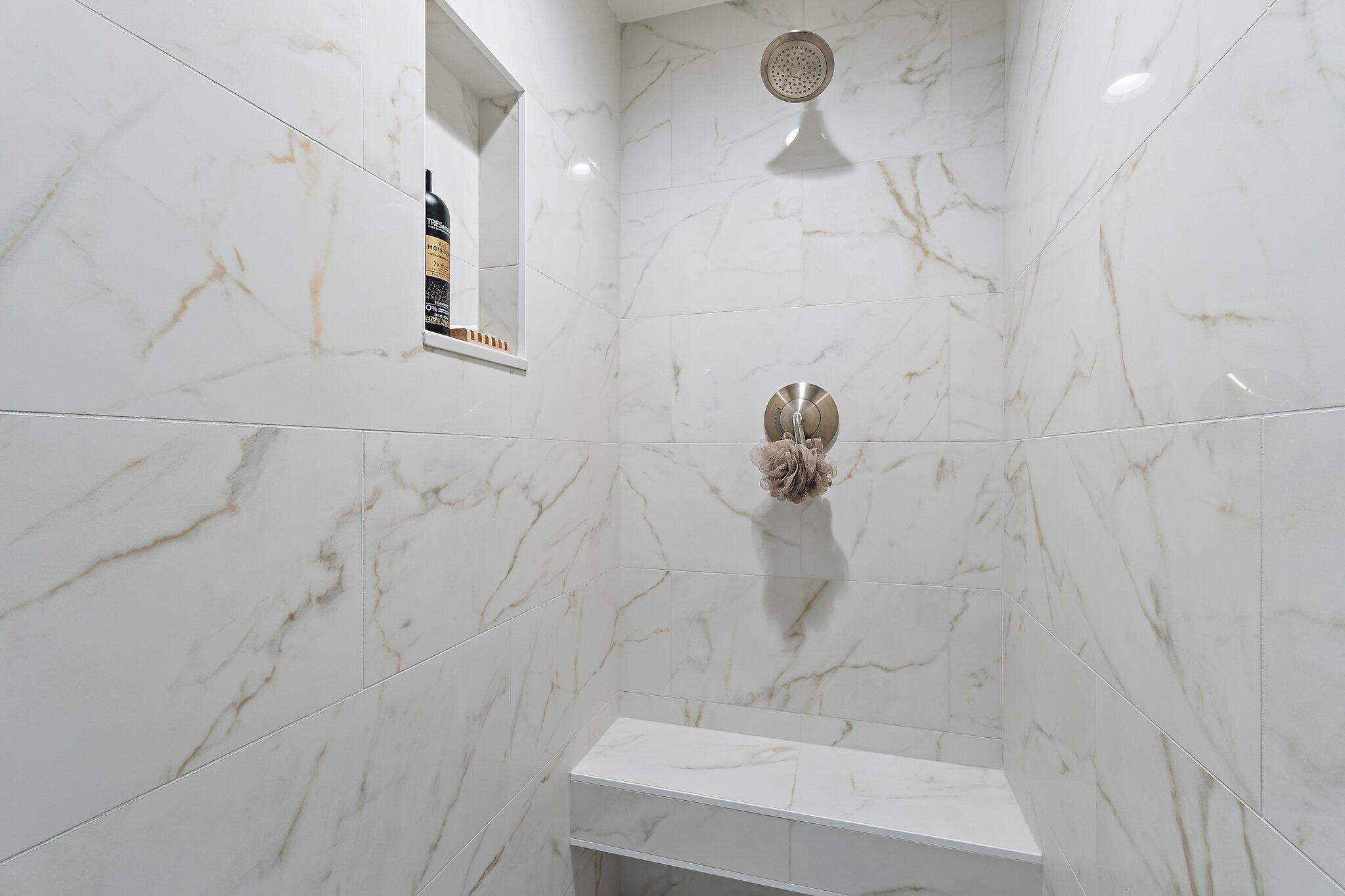 15 Uno Lago Drive, Unit 15 Juno Beach, FL 33408 - Photo 30 of 50 a bathroom with a shower