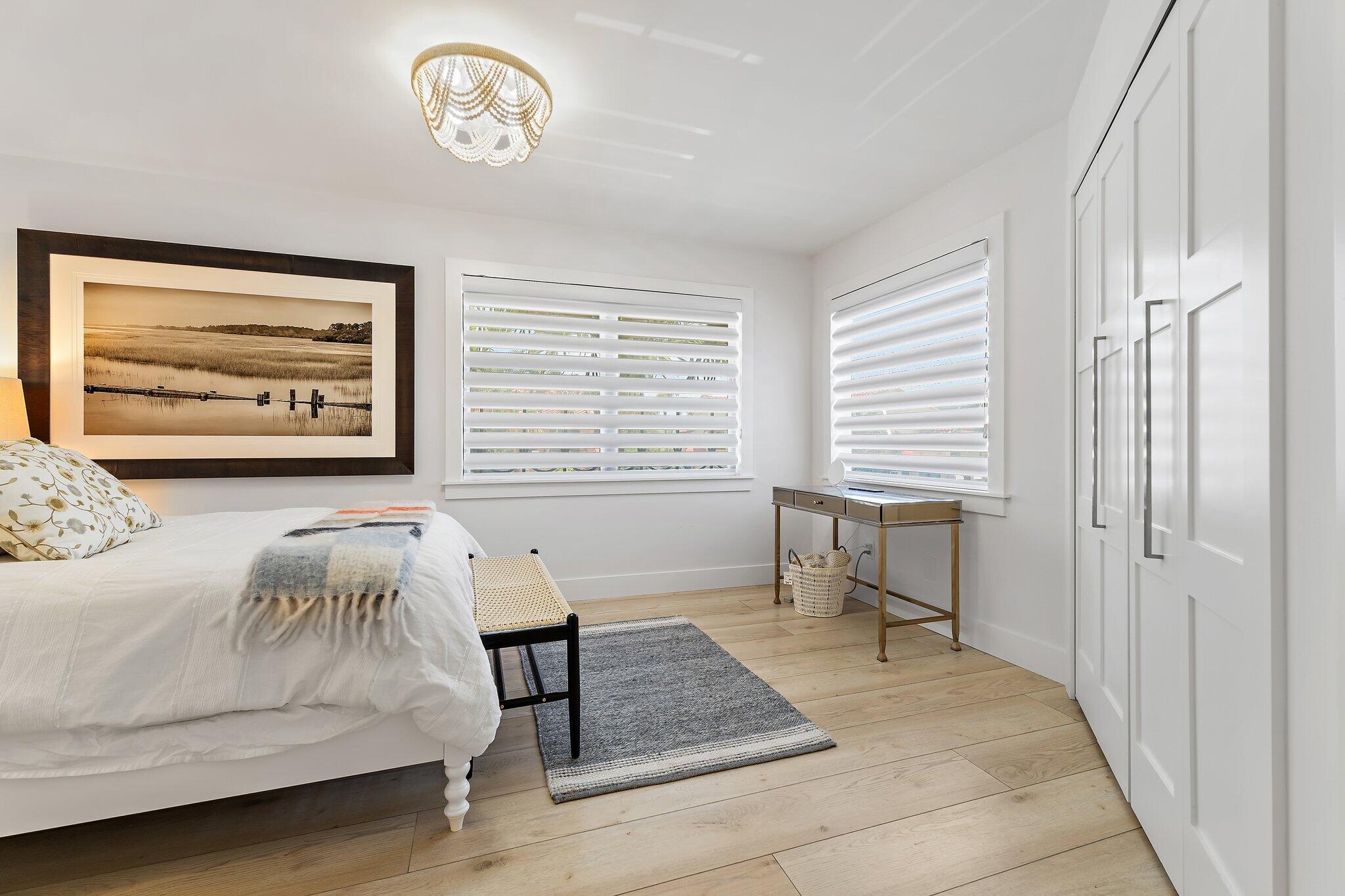 15 Uno Lago Drive, Unit 15 Juno Beach, FL 33408 - Photo 35 of 50 a view of a bedroom with furniture and window