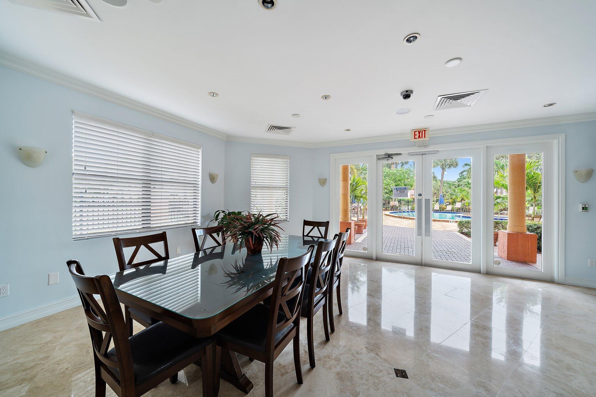 15 Uno Lago Drive, Unit 15 Juno Beach, FL 33408 - Photo 44 of 50 a view of a a dining room with furniture window and wooden floor