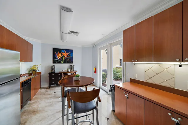 a kitchen with granite countertop a sink stove and cabinets