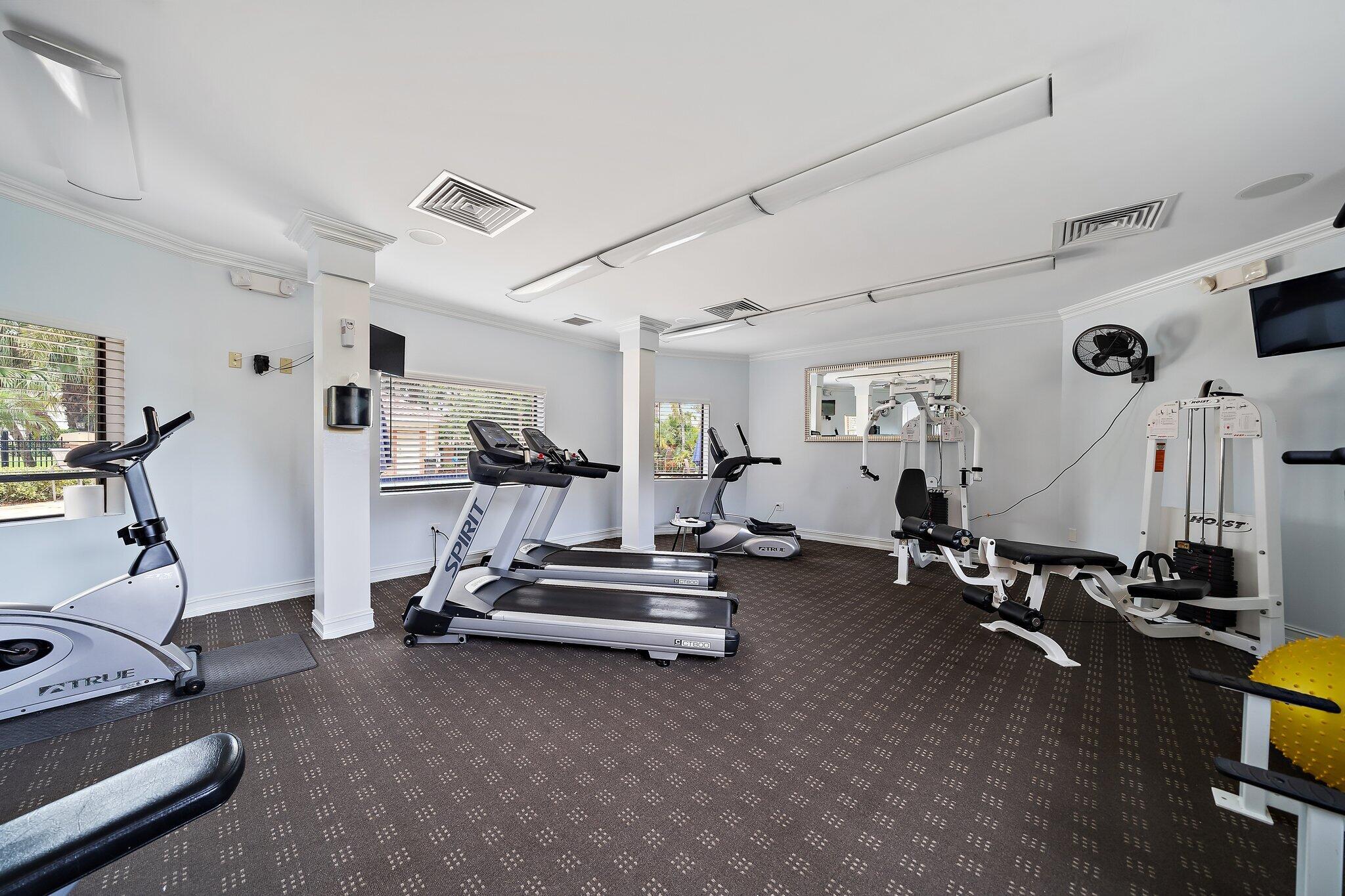 15 Uno Lago Drive, Unit 15 Juno Beach, FL 33408 - Photo 50 of 50 a view of a room with gym equipment