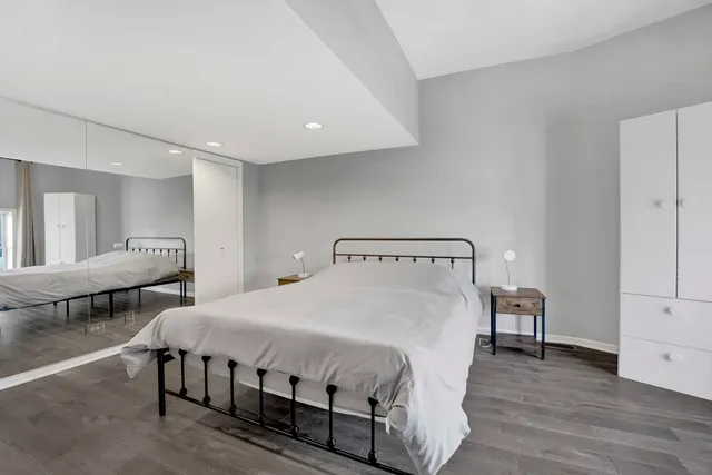 a large white bed in a white room