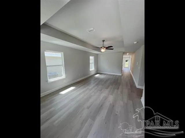 a view of a livingroom with wooden floor