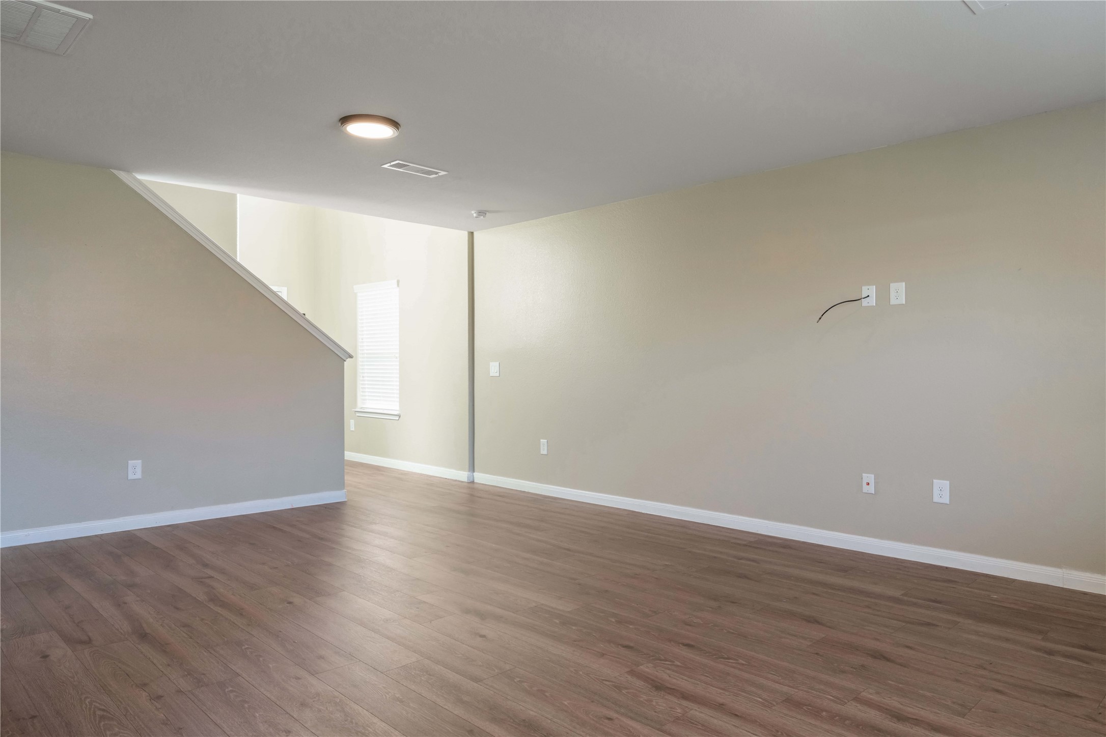 10011 Orchid Spring Lane Houston, TX 77044 - Photo 11 of 42 a view of an empty room with wooden floor