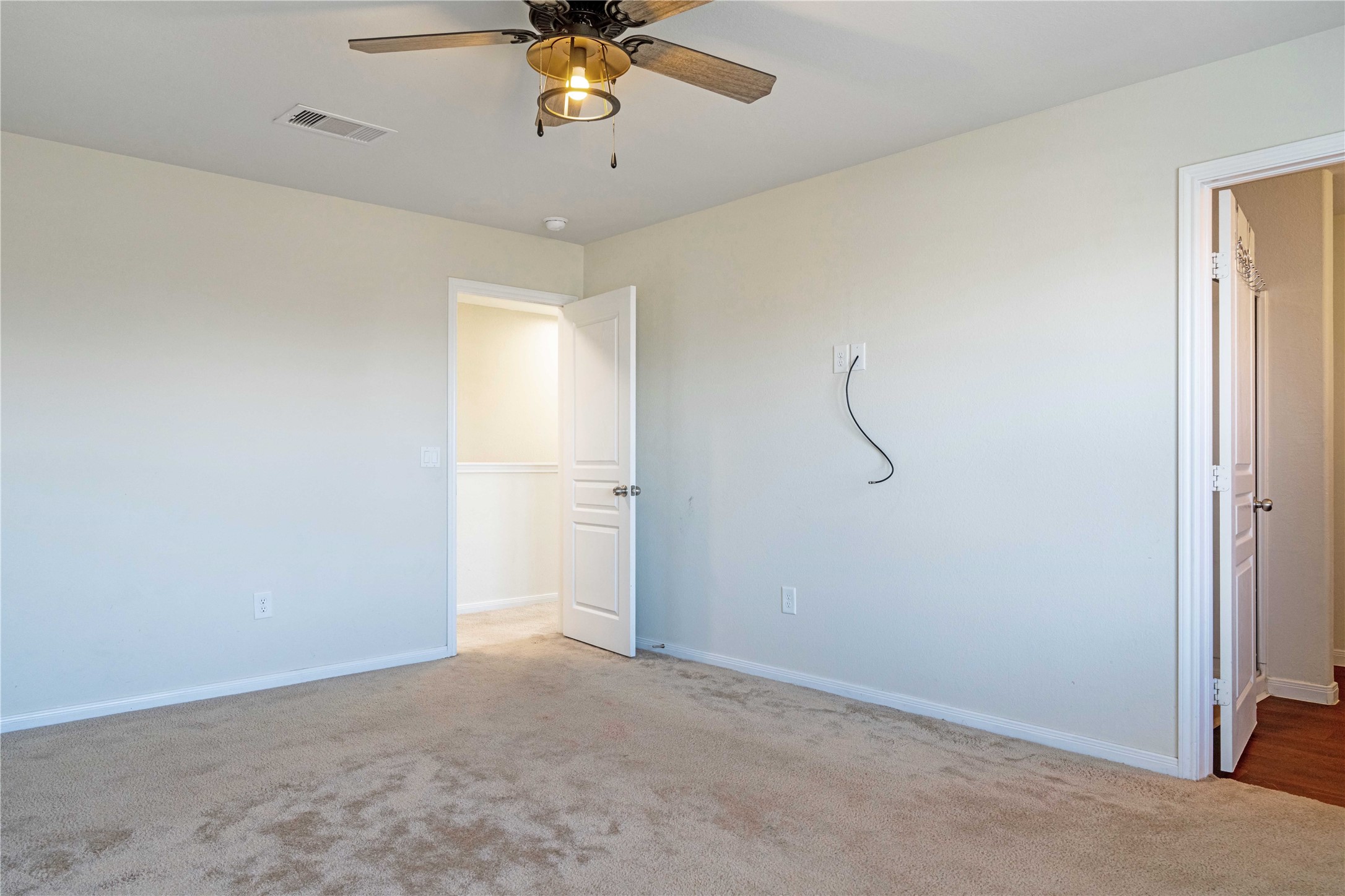 10011 Orchid Spring Lane Houston, TX 77044 - Photo 27 of 42 a view of an empty room with a window