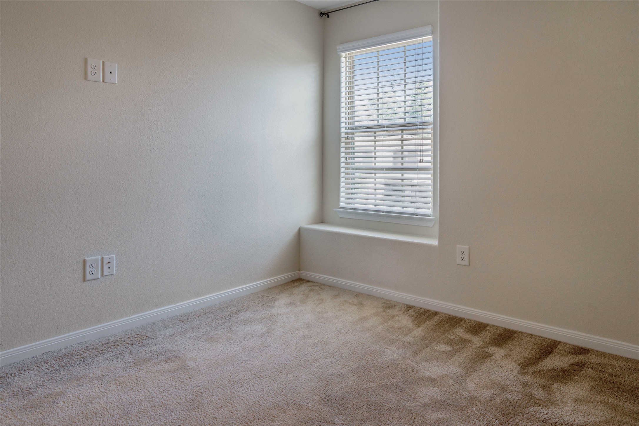 10011 Orchid Spring Lane Houston, TX 77044 - Photo 32 of 42 a view of an empty room with a window