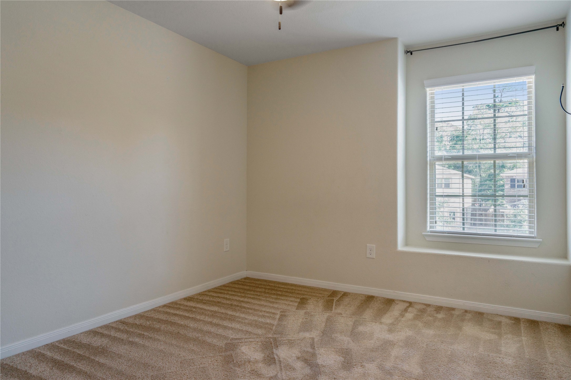 10011 Orchid Spring Lane Houston, TX 77044 - Photo 35 of 42 an empty room with a window