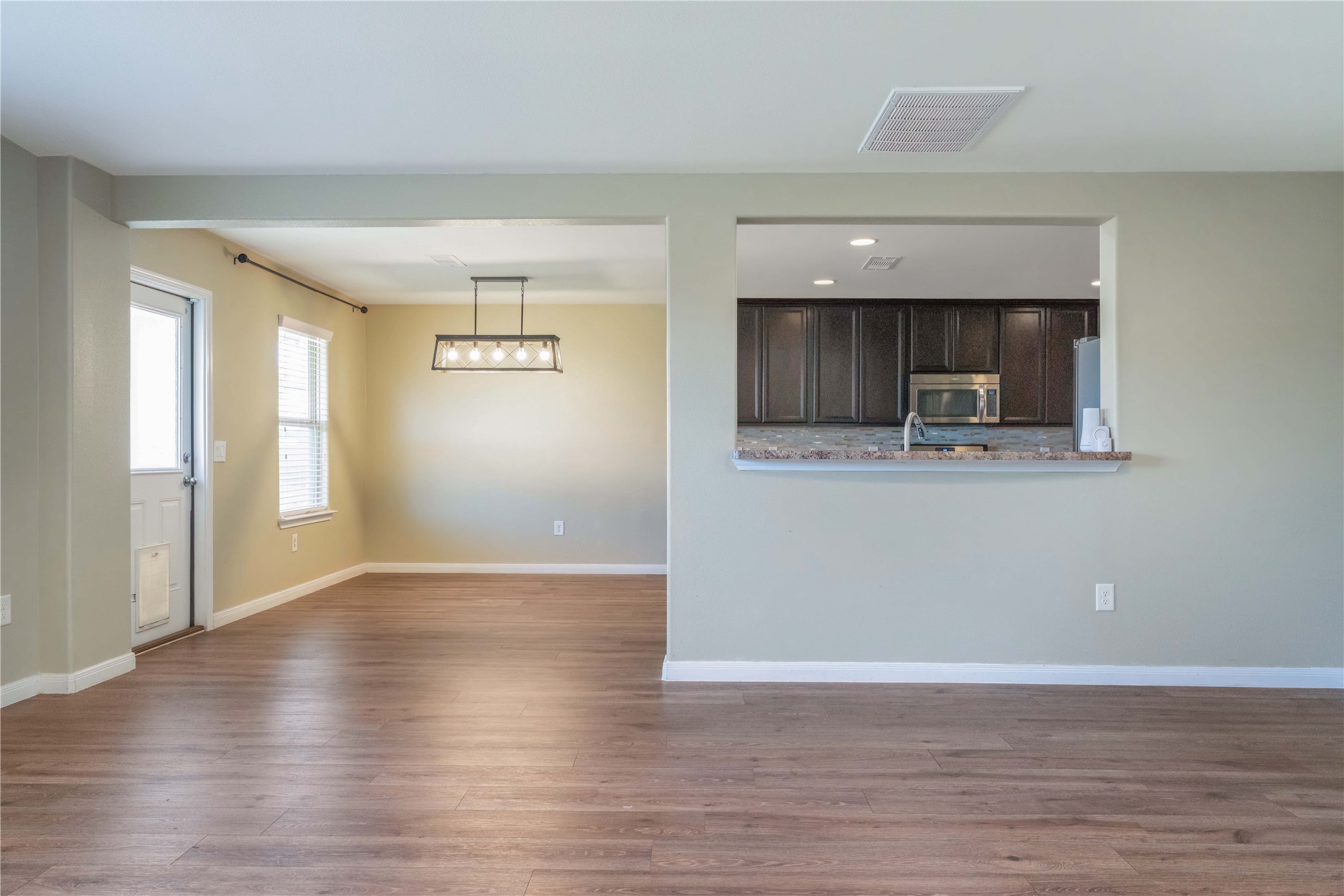 10011 Orchid Spring Lane Houston, TX 77044 - Photo 9 of 42 a view of cabinets and wooden floor