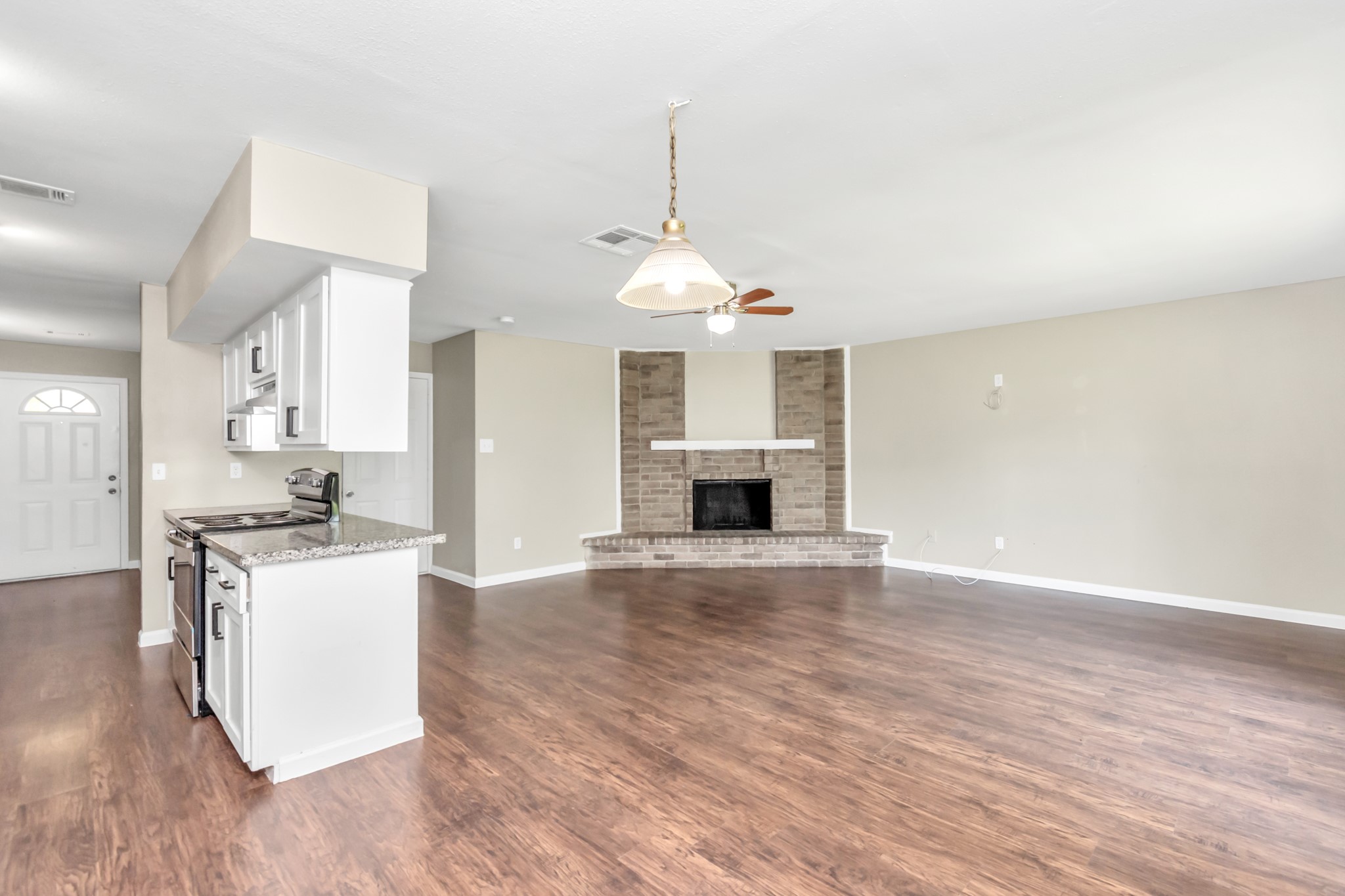 14519 Edenglen Drive Houston, TX 77049 - Photo 18 of 32 a kitchen with kitchen island a sink and a stove