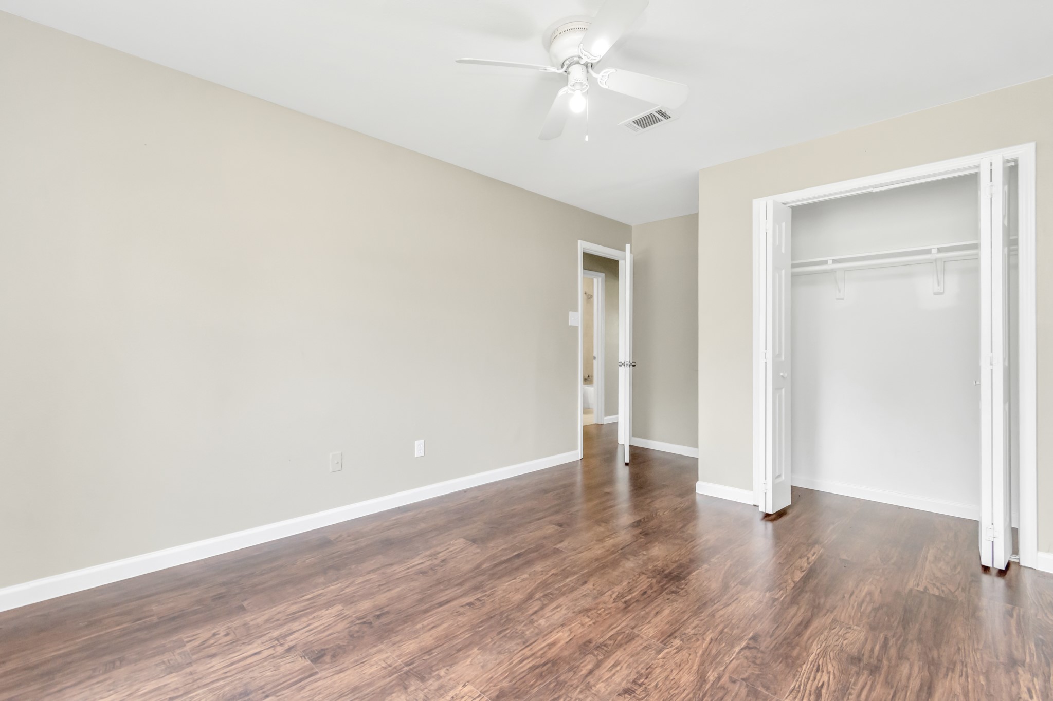 14519 Edenglen Drive Houston, TX 77049 - Photo 23 of 32 a view of an empty room with wooden floor
