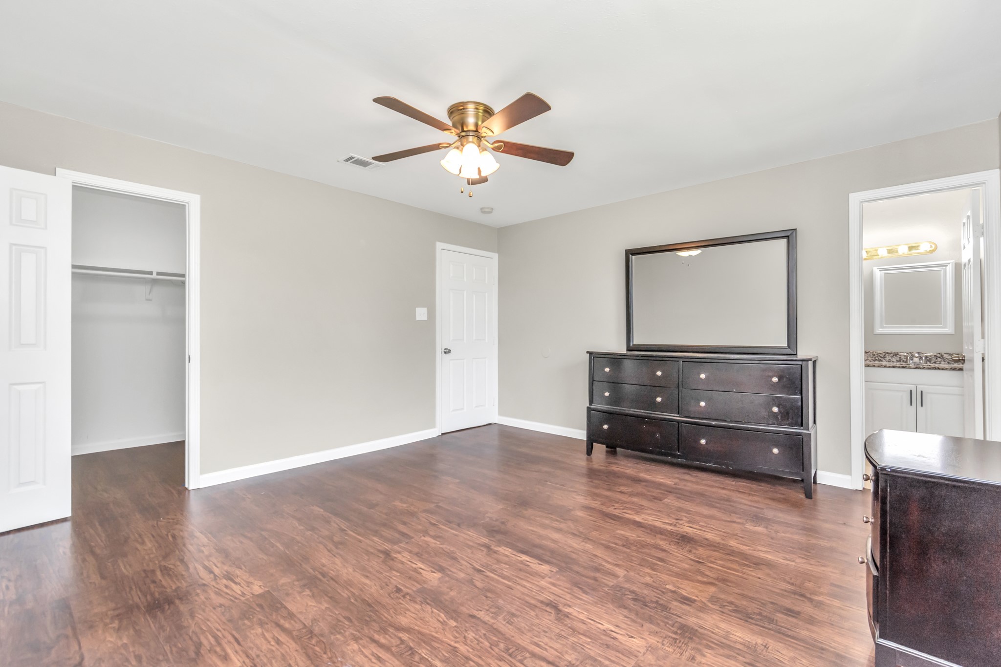 14519 Edenglen Drive Houston, TX 77049 - Photo 26 of 32 a living room with a dresser and a window
