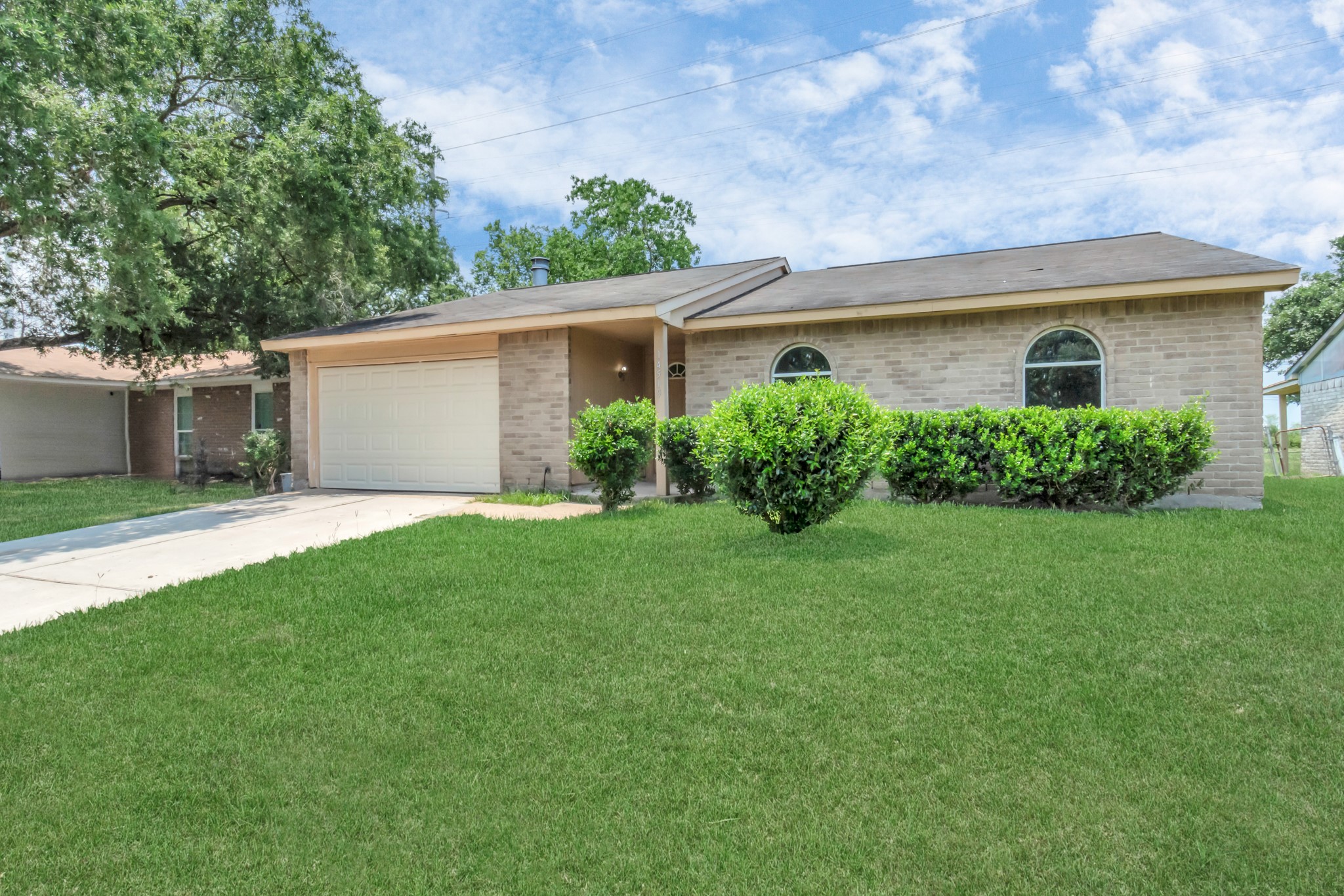 14519 Edenglen Drive Houston, TX 77049 - Photo 4 of 32 front view of a house with a yard