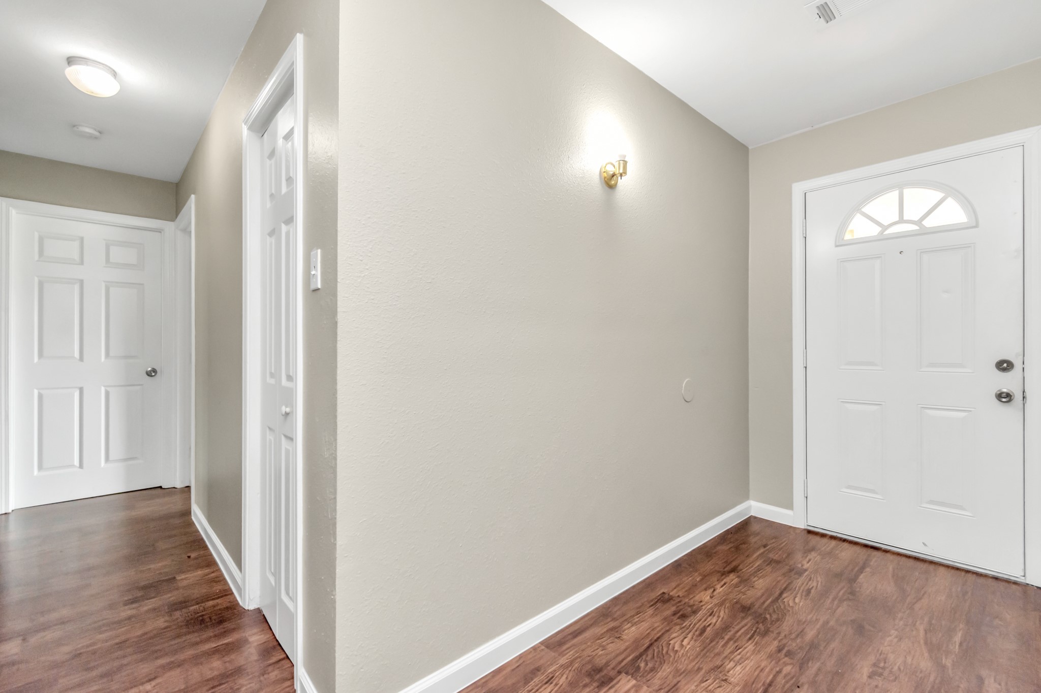 14519 Edenglen Drive Houston, TX 77049 - Photo 10 of 32 a view of a hallway with wooden floor