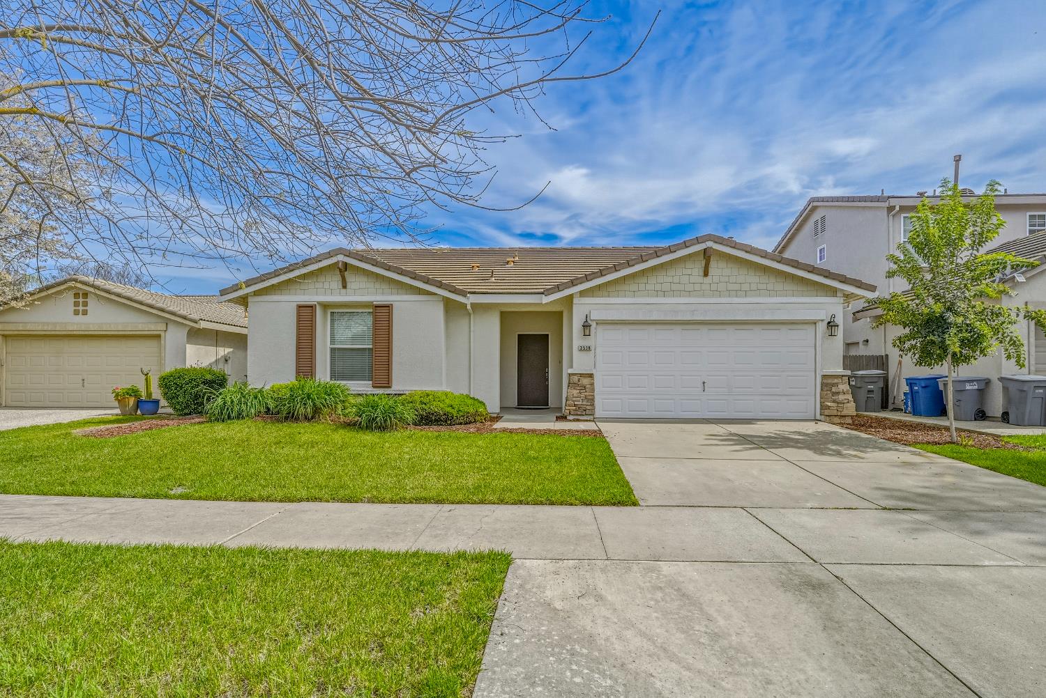 3536 San Isidro Avenue Merced, CA 95348 - Photo 1 of 1 a front view of a house with a yard and garage