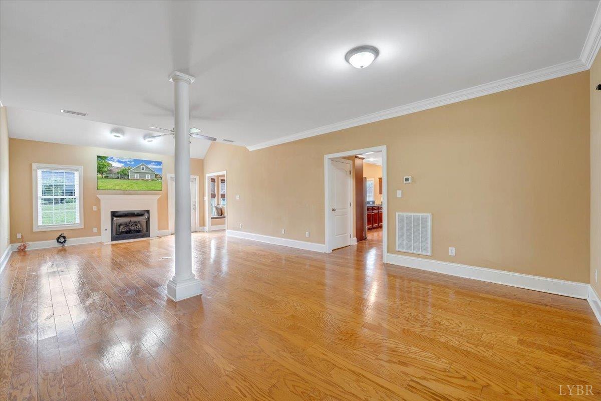 1250 Our Cove Road Huddleston, VA 24104 - Photo 7 of 70 a view of an empty room with wooden floor and a window