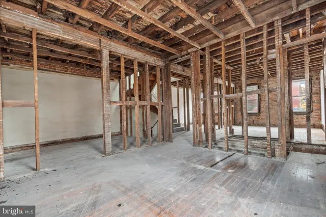 a view of a room with wooden walls