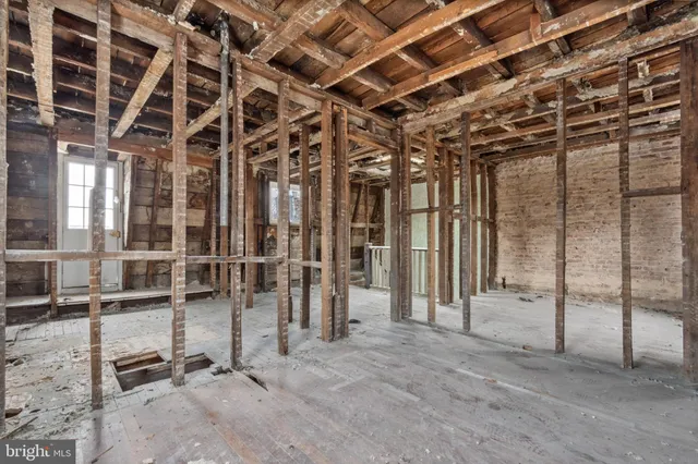 a view of a porch with a table and chair