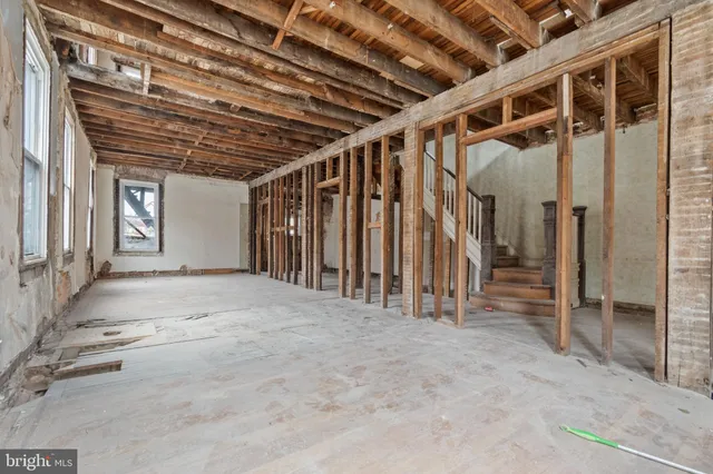 a view of an empty room with wooden walls