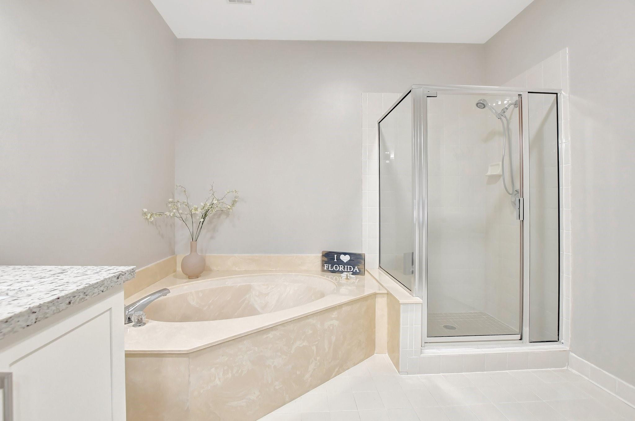 5801 Coach House Circle, Unit E Boca Raton, FL 33486 - Photo 12 of 41 Roman tub to soak away your stress.