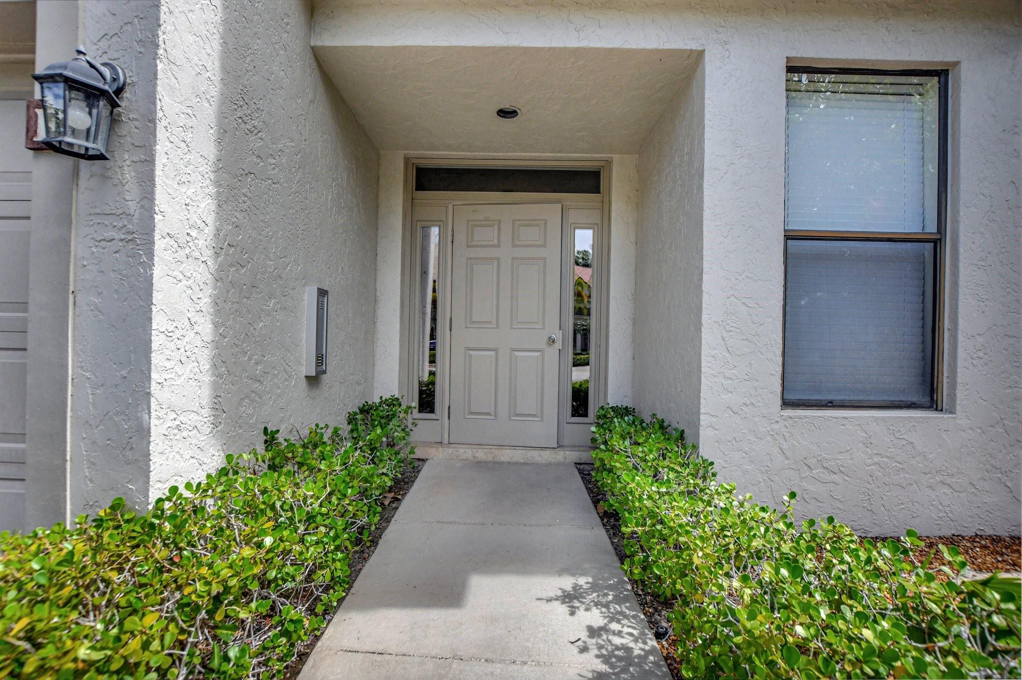 5801 Coach House Circle, Unit E Boca Raton, FL 33486 - Photo 21 of 41 Secure lobby entry.