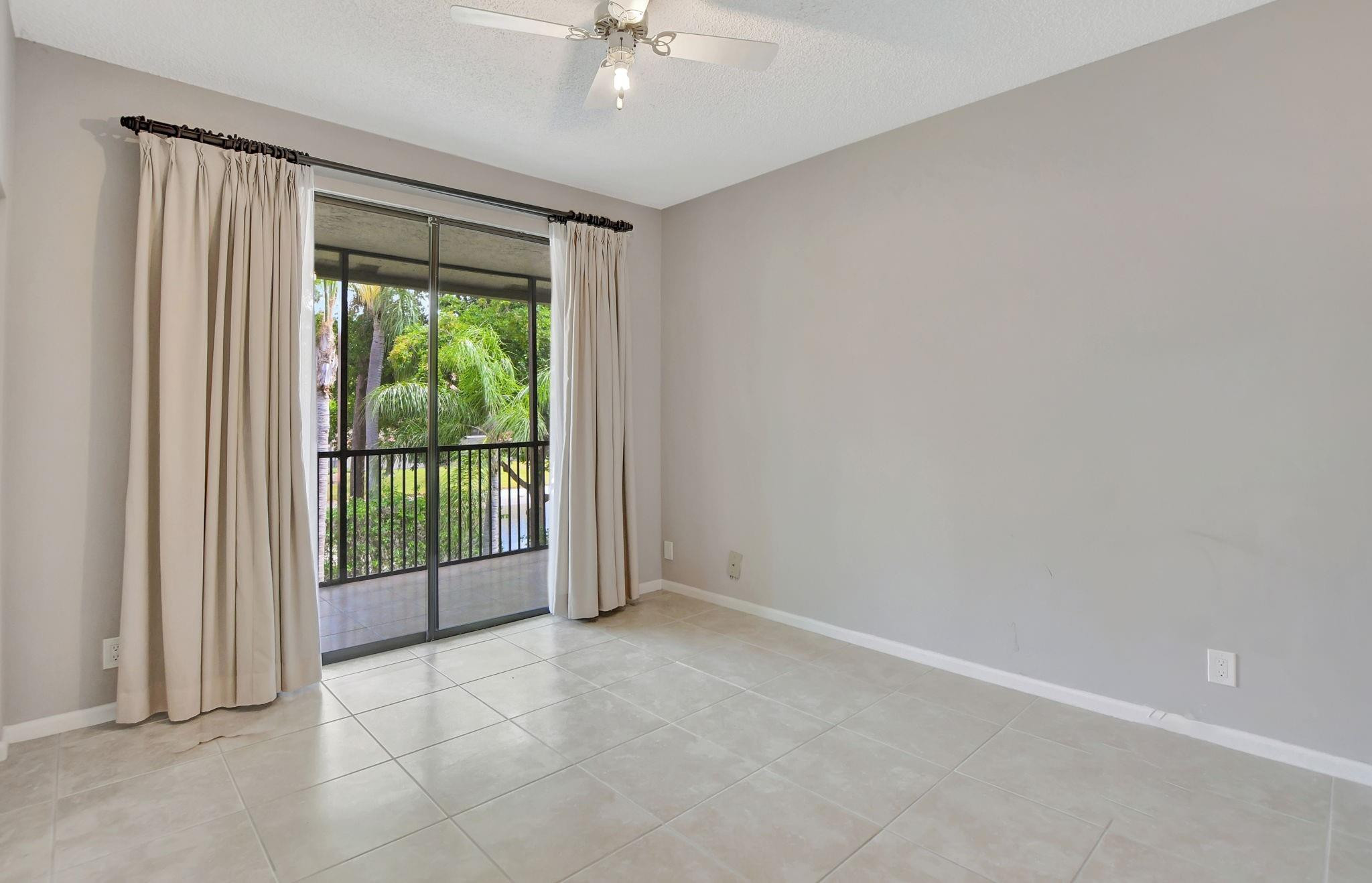 5801 Coach House Circle, Unit E Boca Raton, FL 33486 - Photo 38 of 41 Guest BR 2 with 2 closets.