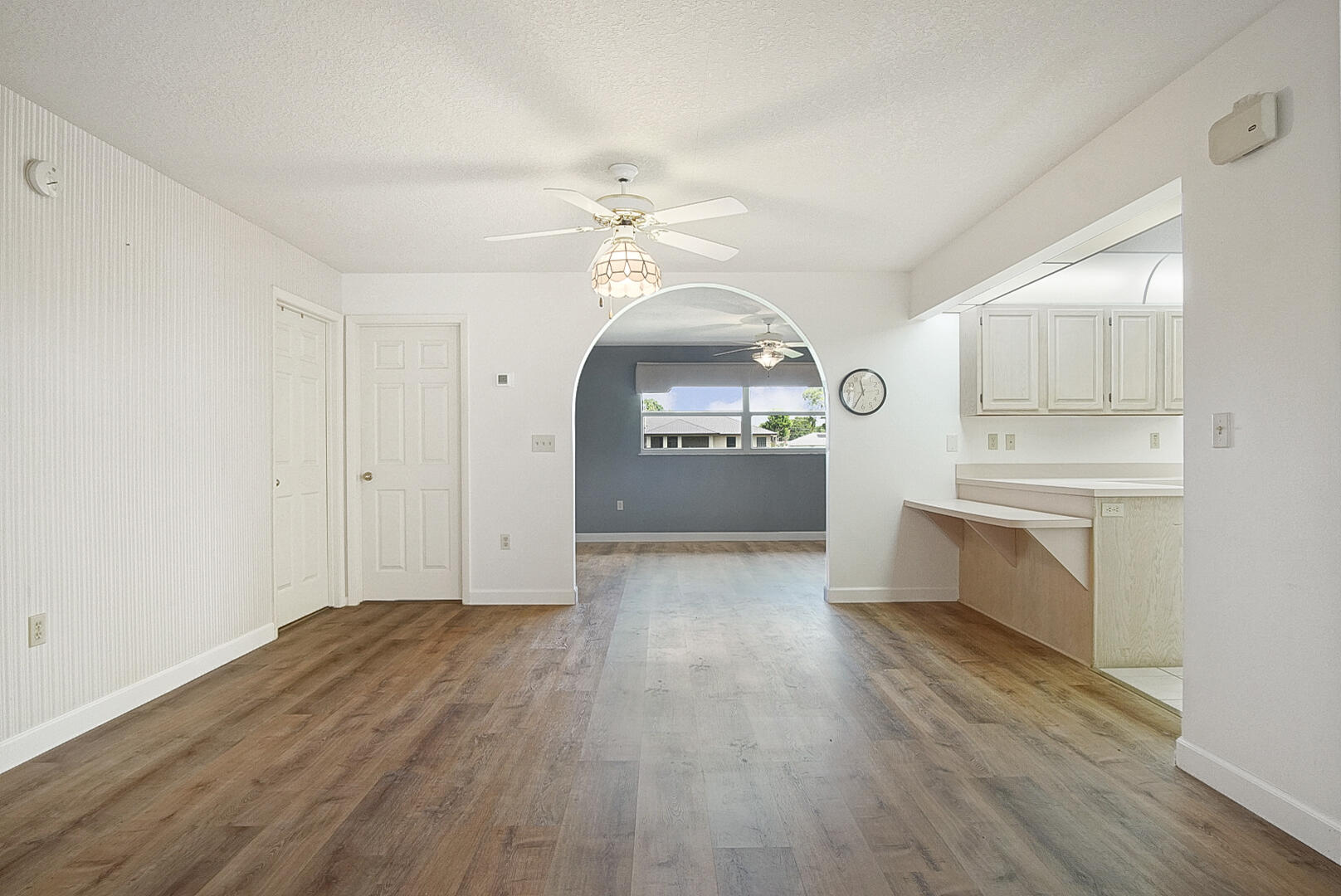 2321 Southwest 3rd Court Okeechobee, FL 34974 - Photo 12 of 37 a view of a kitchen with a sink cabinets and wooden floor