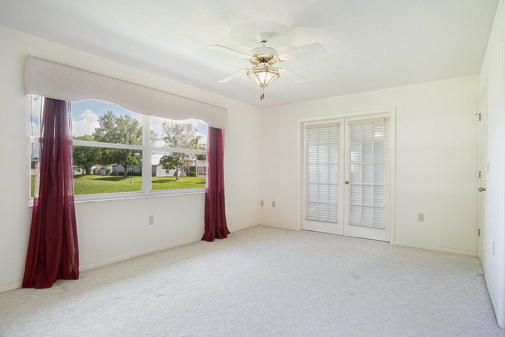 2321 Southwest 3rd Court Okeechobee, FL 34974 - Photo 17 of 35 wooden floor in an empty room with a window