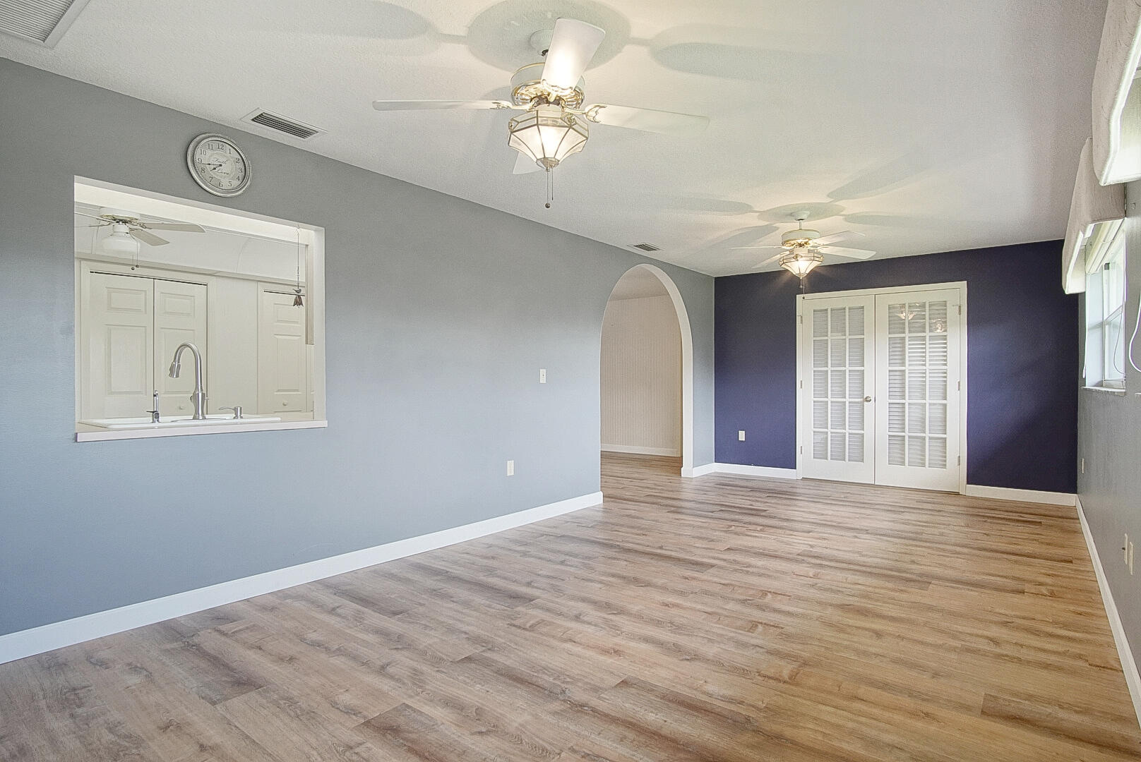 2321 Southwest 3rd Court Okeechobee, FL 34974 - Photo 19 of 35 a view of an empty room with window and wooden floor