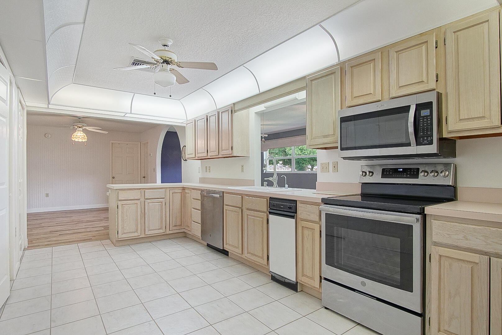 2321 Southwest 3rd Court Okeechobee, FL 34974 - Photo 28 of 37 a kitchen with cabinets appliances and a sink