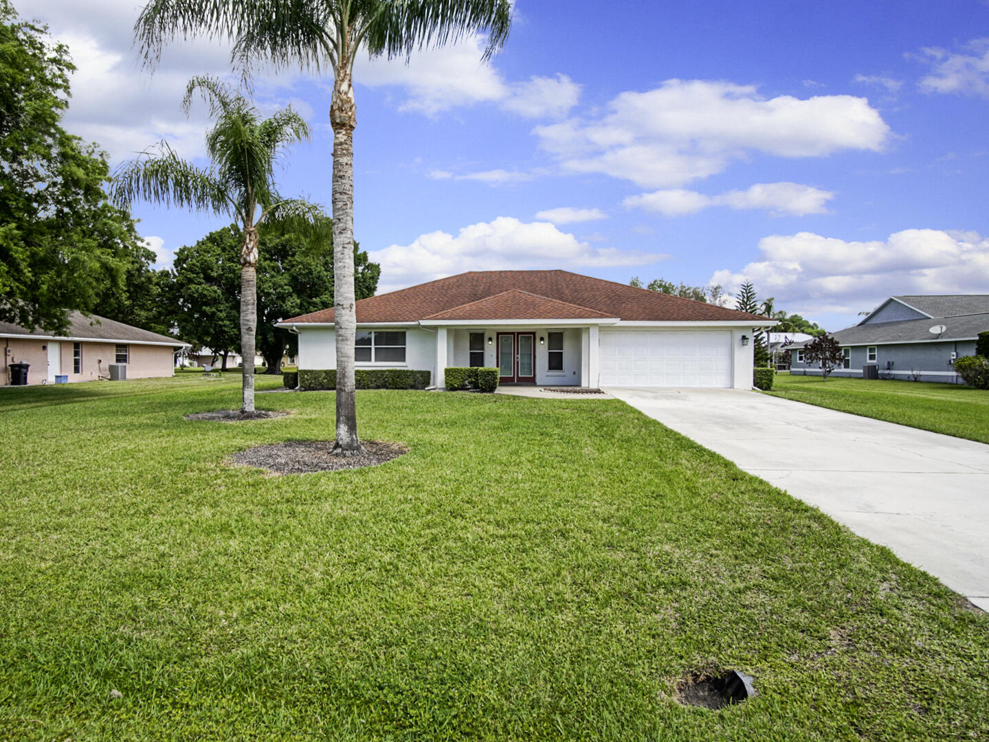 2321 Southwest 3rd Court Okeechobee, FL 34974 - Photo 32 of 35 a front view of a house with garden