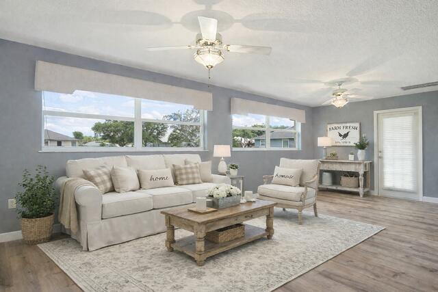 2321 Southwest 3rd Court Okeechobee, FL 34974 - Photo 5 of 35 a living room with furniture and a large window