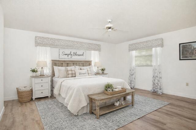 2321 Southwest 3rd Court Okeechobee, FL 34974 - Photo 6 of 37 a bed room with a bed and a lamp