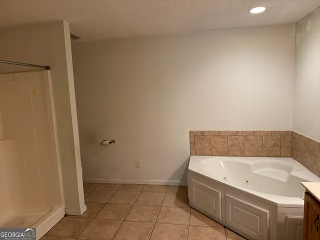 a kitchen with refrigerator and window