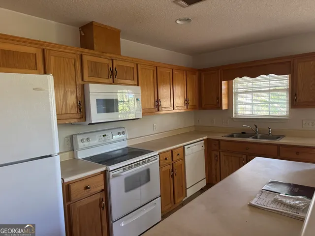 a house with trees in the background