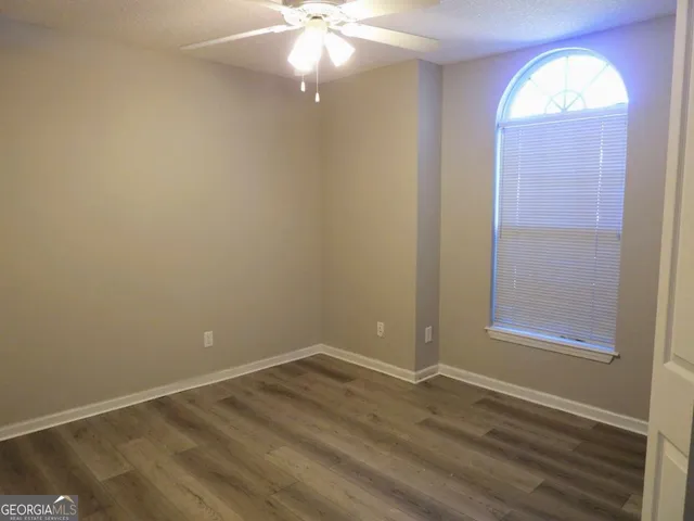 an empty room with a mirror