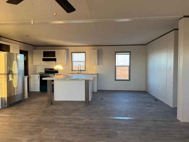 a view of a kitchen with a sink