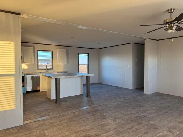 a kitchen that has a sink and a stove