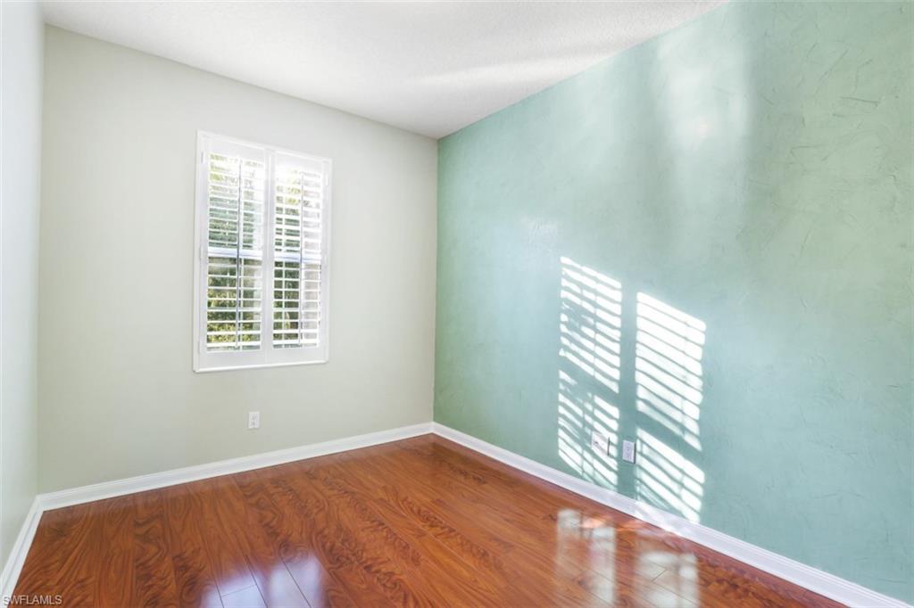 5721 Cove Circle, Unit 36 Naples, FL 34119 - Photo 14 of 32 a view of an empty room and window