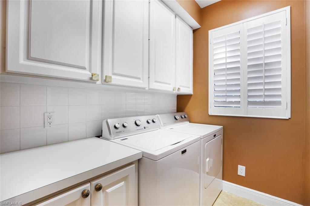 5721 Cove Circle, Unit 36 Naples, FL 34119 - Photo 18 of 32 a utility room with dryer and washer