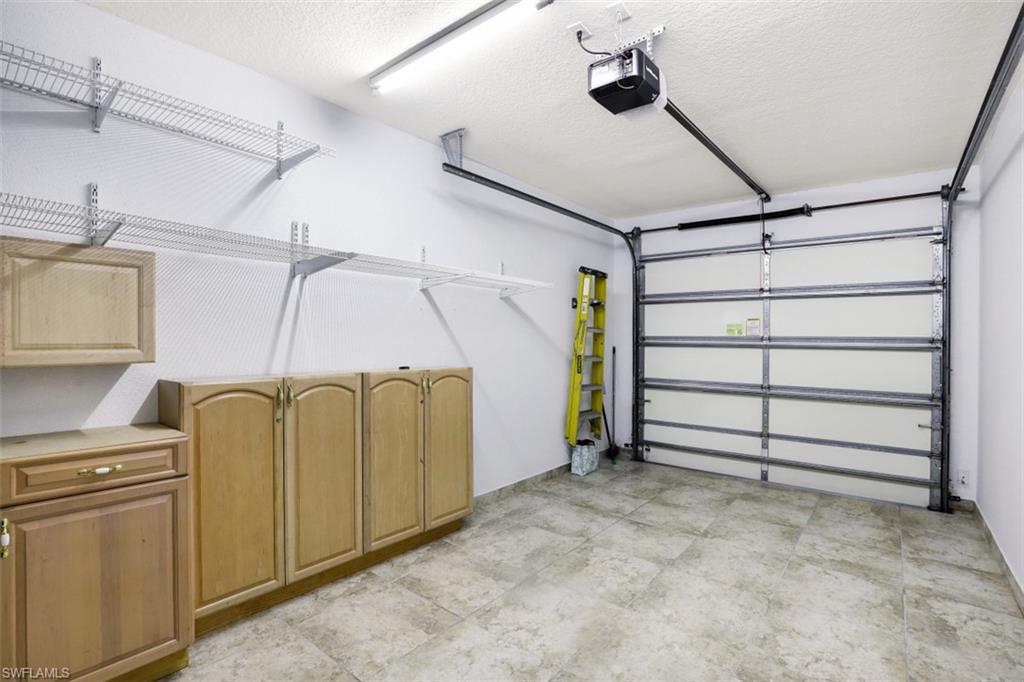 5721 Cove Circle, Unit 36 Naples, FL 34119 - Photo 19 of 32 a view of a garage