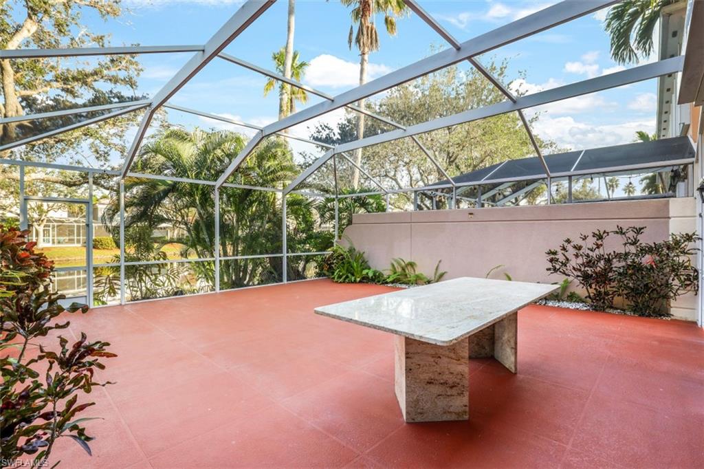 5721 Cove Circle, Unit 36 Naples, FL 34119 - Photo 21 of 32 a view of an outdoor space
