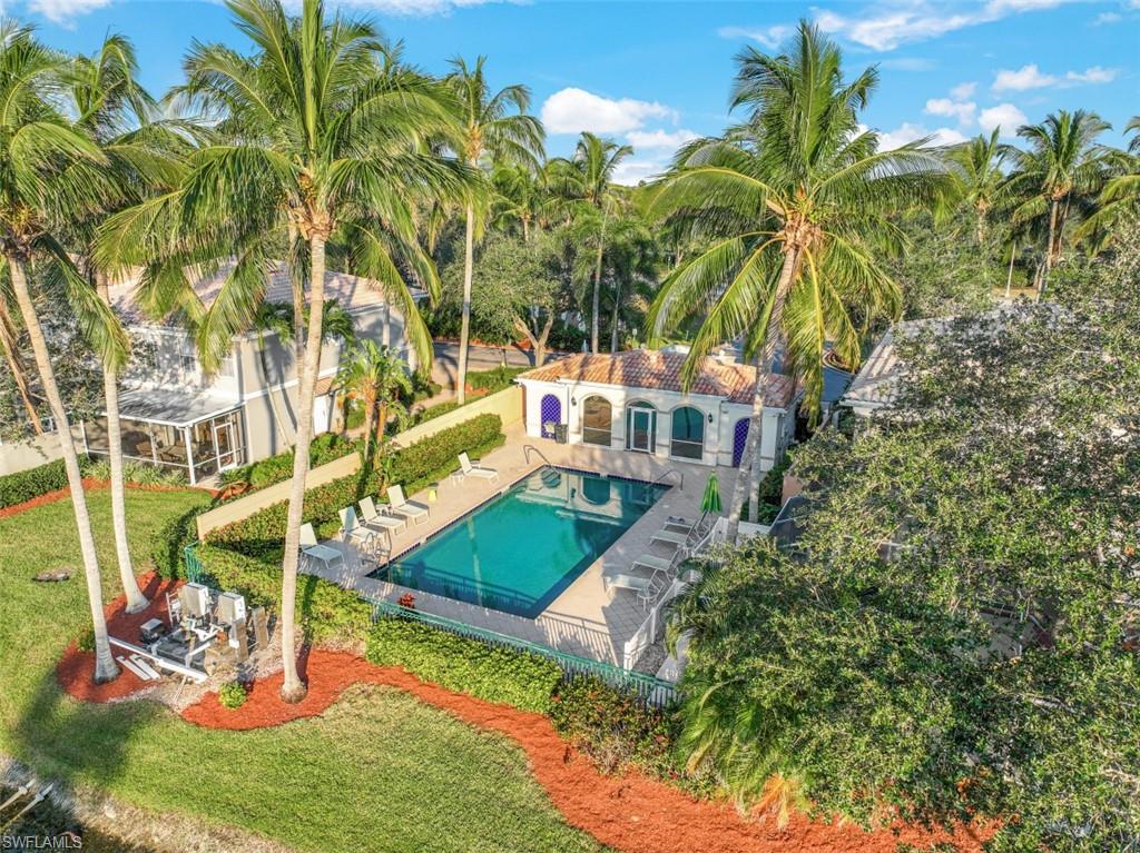 5721 Cove Circle, Unit 36 Naples, FL 34119 - Photo 27 of 32 a view of a yard with plants
